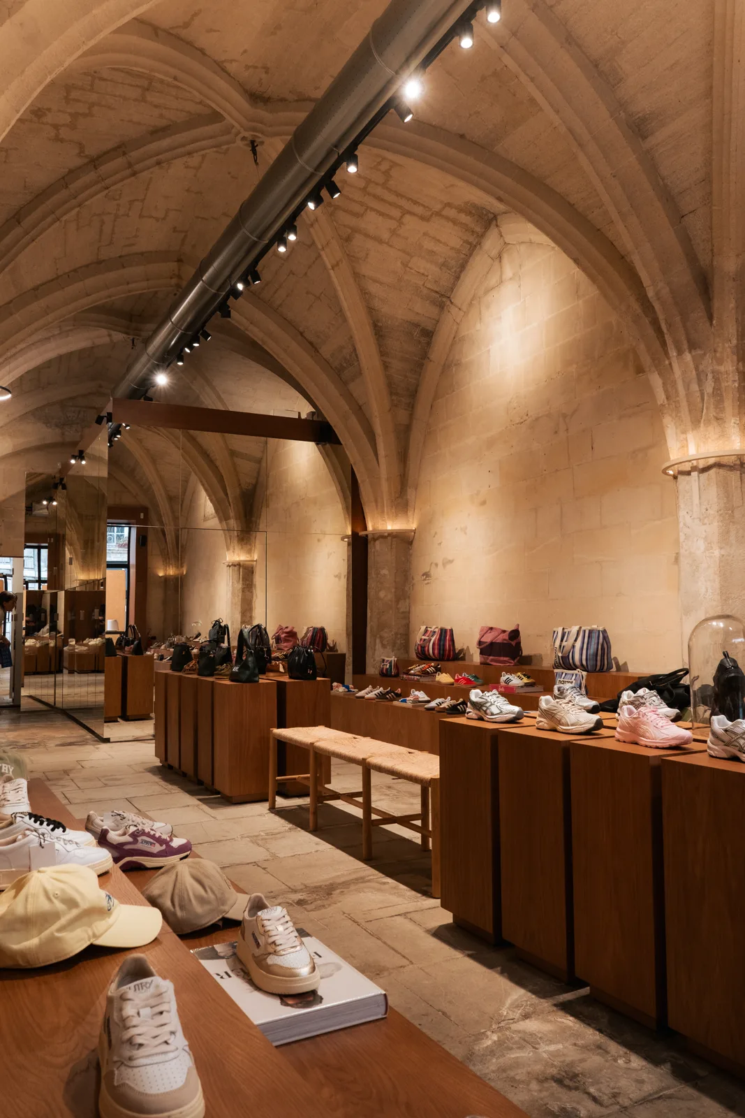 Interior of a Lulli boutique, a stone-walled showcase for the designer selection